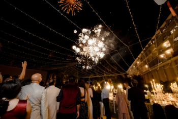 Fireworks lighting up the sky at the end of a sangeet night during an Indian destination wedding celebration in Mexico
