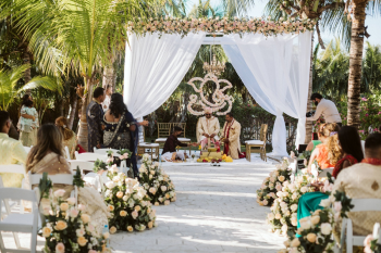 Indian wedding reception setup at the Frida Garden Terrace featuring elegant décor, glowing lighting, and an open-air celebration space surrounded by tropical scenery.
Indian wedding reception setup at the Frida Garden Terrace featuring elegant décor, glowing lighting, and an open-air celebration space surrounded by tropical scenery.