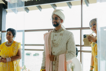 Eshwar watching Malena’s bridal entrance during their Hindu wedding ceremony