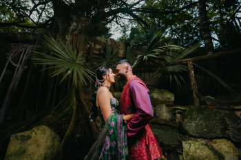 Katherine and Marun share a quiet moment
together during their sangeet celebration surrounded by lush tropical greenery.
