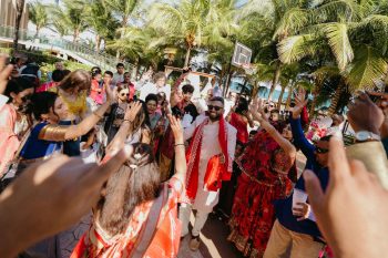 Marun dances through his baraat procession
surrounded by family and friends on the resort grounds.