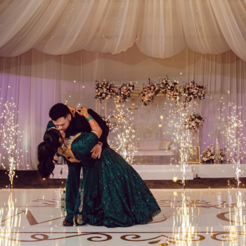 Meha and Gilbert share a dramatic dip
during their first dance as indoor sparklers illuminate the dance floor around
them. Meha and Gilbert share a dramatic dip
during their first dance as indoor sparklers illuminate the dance floor around
them.