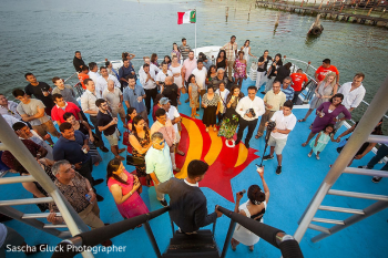 Guests gathered on a boat during Jignya and Pranav’s destination wedding welcome party in Mexico