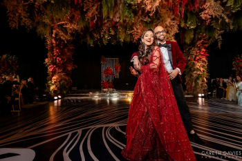Digisha and Ronak dancing at their Indian wedding reception with elegant decor and lighting at Dreams Bahia Mita