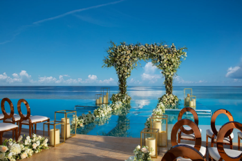 Elegant floral mandap overlooking the ocean at Dreams Natura for an Indian destination wedding ceremony. Elegant floral mandap overlooking the ocean at Dreams Natura for an Indian destination wedding ceremony.
