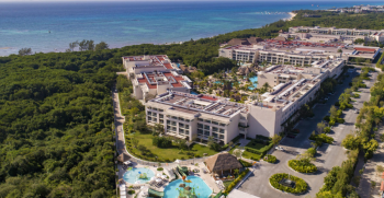 Aerial view of Paradisus Playa del Carmen, illustrating how a resort's layout, guest room locations, and venue placement influence the experience of an Indian destination wedding. Aerial view of Paradisus Playa del Carmen, illustrating how a resort's layout, guest room locations, and venue placement influence the experience of an Indian destination wedding.