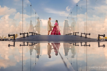 Gopi and Nick celebrating their Indian destination wedding at Royalton Splash Riviera Cancun, illustrating the value of asking detailed questions when selecting a wedding resort. Gopi and Nick celebrating their Indian destination wedding at Royalton Splash Riviera Cancun, illustrating the value of asking detailed questions when selecting a wedding resort.
