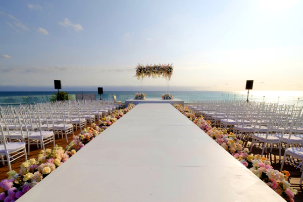 Oceanfront mandap and aisle at Ummae and Ryan's Indian destination wedding ceremony.