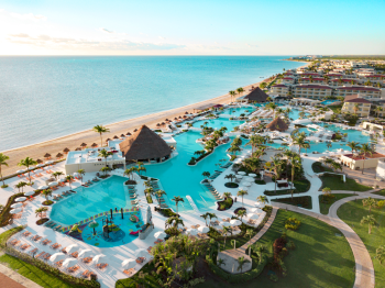 Aerial view of Moon Palace Cancun Sunrise section with expansive pools, beachfront, and tropical landscaping Aerial view of Moon Palace Cancun Sunrise section with expansive pools, beachfront, and tropical landscaping