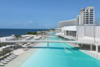Modern beachfront resort with curved architecture, infinity pools, and ocean views at AVA Resort Cancun Modern beachfront resort with curved architecture, infinity pools, and ocean views at AVA Resort Cancun