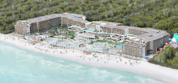 Aerial view of a beachfront resort with large pools, palm-lined grounds, and on-site water park at Royalton Splash Riviera Cancun Aerial view of a beachfront resort with large pools, palm-lined grounds, and on-site water park at Royalton Splash Riviera Cancun
