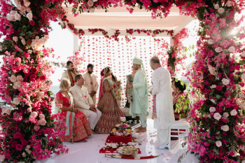 Shabnam and Kynan wedding ceremony at Garza Blanca Los Cabos featured a seaside wedding ceremony where they exchanged vows beneath an elaborate pink and cream floral mandap, surrounded by family members. Shabnam and Kynan wedding ceremony at Garza Blanca Los Cabos featured a seaside wedding ceremony where they exchanged vows beneath an elaborate pink and cream floral mandap, surrounded by family members.