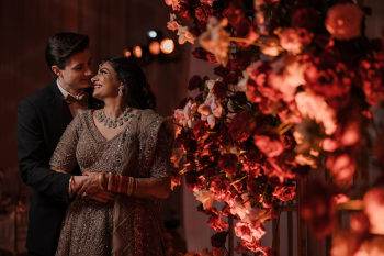Simran and Ben share a quiet moment during their Indian destination wedding reception at Moon Palace Cancun, surrounded by elegant floral décor and luxury ballroom details in Mexico. Simran and Ben share a quiet moment during their Indian destination wedding reception at Moon Palace Cancun, surrounded by elegant floral décor and luxury ballroom details in Mexico.