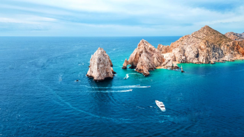 Aerial view of El Arco at Land's End in Los Cabos, Mexico, showcasing the dramatic desert coastline and Pacific waters that make the region a unique destination for Indian destination weddings. Aerial view of El Arco at Land's End in Los Cabos, Mexico, showcasing the dramatic desert coastline and Pacific waters that make the region a unique destination for Indian destination weddings.