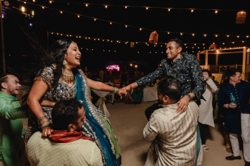 Sanjana and Hirsh celebrate their sangeet with family and friends at Generations Riviera Maya and El Dorado Royale, capturing the vibrant energy of an Indian destination wedding in Mexico. Sanjana and Hirsh celebrate their sangeet with family and friends at Generations Riviera Maya and El Dorado Royale, capturing the vibrant energy of an Indian destination wedding in Mexico.
