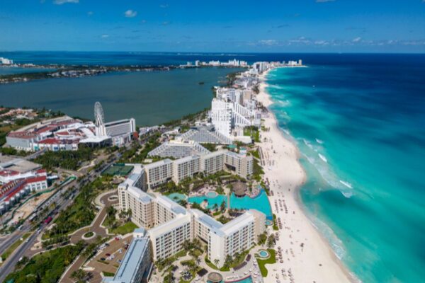 Aerial view of Cancun's Hotel Zone showcasing turquoise Caribbean beaches, luxury all-inclusive resorts, and one of Mexico's most popular destinations for Indian destination weddings.