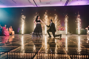 Mala and Anush's grand reception entrance at AVA Resort Cancun during their Indian destination wedding, featuring a custom LED dance floor and indoor ballroom celebration. Mala and Anush's grand reception entrance at AVA Resort Cancun during their Indian destination wedding, featuring a custom LED dance floor and indoor ballroom celebration.
