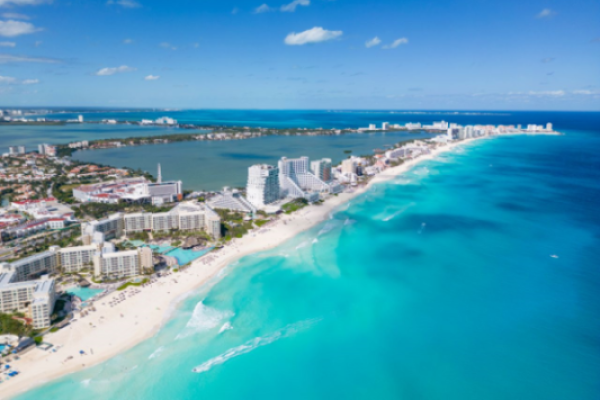 Panoramic aerial view of Cancun's Hotel Zone featuring luxury beachfront resorts ideal for Indian destination weddings in Cancun.