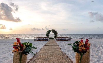 Beachfront Indian wedding ceremony setup at Moon Palace The Grand overlooking the Caribbean Sea at sunset Beachfront Indian wedding ceremony setup at Moon Palace The Grand overlooking the Caribbean Sea at sunset