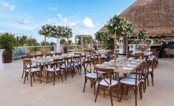Beachfront Indian wedding ceremony setup at Moon Palace The Grand overlooking the Caribbean Sea at sunset Beachfront Indian wedding ceremony setup at Moon Palace The Grand overlooking the Caribbean Sea at sunset