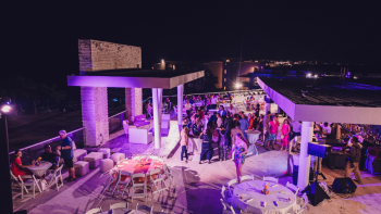 Indian wedding Welcome Night at Cusco Terrace, Moon Palace The Grand, with purple uplighting and guests dancing Indian wedding Welcome Night at Cusco Terrace, Moon Palace The Grand, with purple uplighting and guests dancing