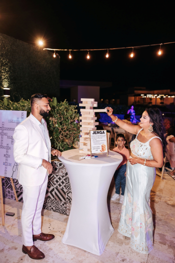 Giant Jenga wedding guest game at an Indian Welcome Night reception in Cancun Giant Jenga wedding guest game at an Indian Welcome Night reception in Cancun