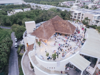 Aerial view of a rooftop Indian wedding Welcome Night reception under a palapa roof at Moon Palace The Grand Aerial view of a rooftop Indian wedding Welcome Night reception under a palapa roof at Moon Palace The Grand