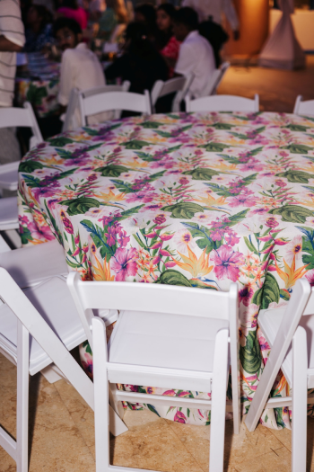 Tropical botanical print tablecloth at an Indian wedding Welcome Night reception in Cancun Tropical botanical print tablecloth at an Indian wedding Welcome Night reception in Cancun