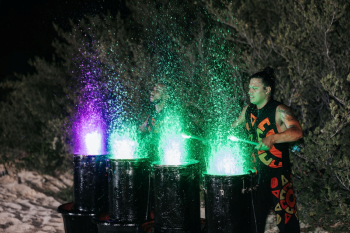 Water drummers perform a show at a beach wedding celebration at night Water drummers perform a show at a beach wedding celebration at night