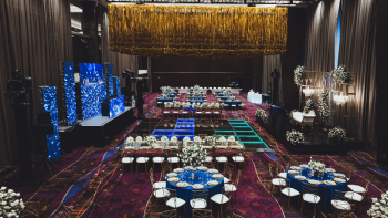 Gold tinsel fringe ceiling installation at an Indian wedding reception ballroom Gold tinsel fringe ceiling installation at an Indian wedding reception ballroom