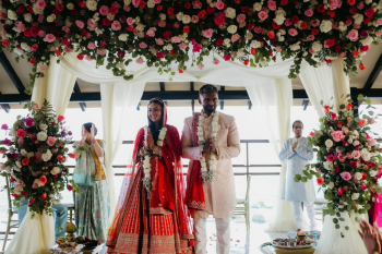 Bride Katherine and groom Marun during their Hindu wedding ceremony on an oceanfront pier deck at Generations Riviera Maya Bride Katherine and groom Marun during their Hindu wedding ceremony on an oceanfront pier deck at Generations Riviera Maya