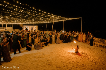Fire performer entertaining guests during Alanna and Abhishek's beach reception at Generations Riviera Maya and El Dorado Royale. Fire performer entertaining guests during Alanna and Abhishek's beach reception at Generations Riviera Maya and El Dorado Royale.