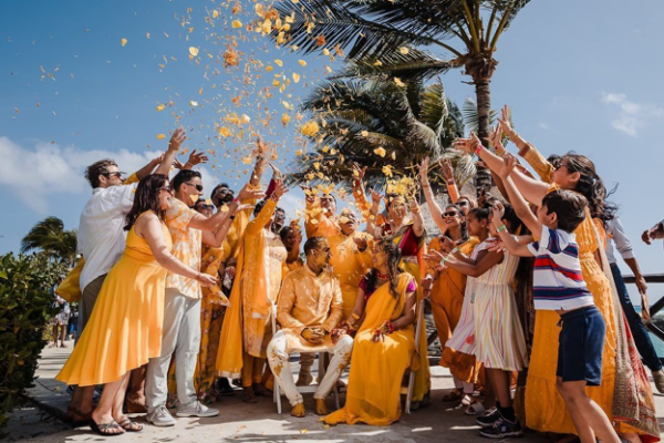 Monika and Rajiv celebrate their Haldi ceremony with family and friends at Hard Rock Riviera Maya during their Indian destination wedding in Mexico.
