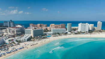 Aerial view of Cancun's hotel zone and turquoise coastline, one of the most popular regions for Sikh destination weddings in Mexico Aerial view of Cancun's hotel zone and turquoise coastline, one of the most popular regions for Sikh destination weddings in Mexico