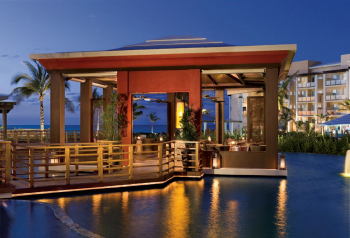 Spice restaurant at Dreams Jade Resort and Spa, an Asian dining venue with a Zen garden setting, teppanyaki tables, and a sushi bar. Spice restaurant at Dreams Jade Resort and Spa, an Asian dining venue with a Zen garden setting, teppanyaki tables, and a sushi bar.