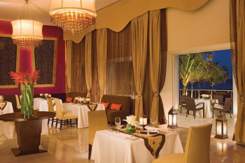 Mercure restaurant at Dreams Jade Resort and Spa, an elegant French dining room with rich drapery, chandeliers, and views of the tropical grounds. Mercure restaurant at Dreams Jade Resort and Spa, an elegant French dining room with rich drapery, chandeliers, and views of the tropical grounds.