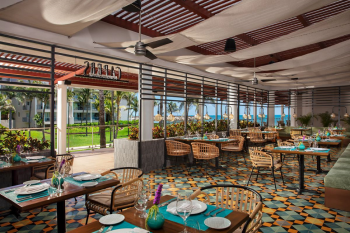 Capers Italian restaurant at Dreams Jade Resort and Spa, an open-air dining space with Tuscan-inspired décor and ocean views. Capers Italian restaurant at Dreams Jade Resort and Spa, an open-air dining space with Tuscan-inspired décor and ocean views.