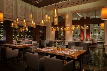 Tamarindo restaurant at Dreams Jade Resort and Spa, a Mexican specialty restaurant with warm lighting and a wine wall. Tamarindo restaurant at Dreams Jade Resort and Spa, a Mexican specialty restaurant with warm lighting and a wine wall.