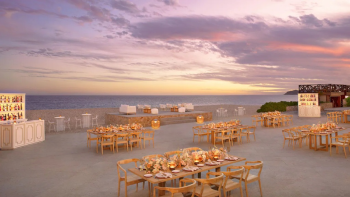 Sunset wedding reception setup at Cascada Pool Terrace at Dreams Los Cabos Suites Golf Resort & Spa Sunset wedding reception setup at Cascada Pool Terrace at Dreams Los Cabos Suites Golf Resort & Spa
