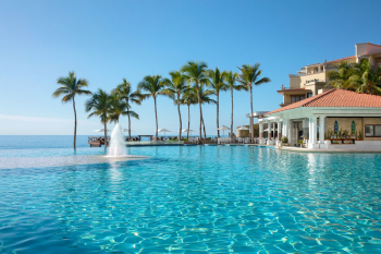 Infinity pool overlooking the ocean at Dreams Los Cabos Suites Golf Resort & Spa Infinity pool overlooking the ocean at Dreams Los Cabos Suites Golf Resort & Spa